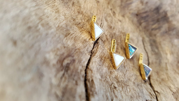 Triangle shell earring jackets in 14kt yellow gold.