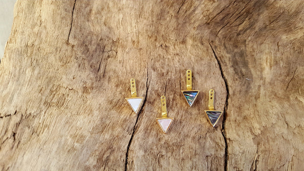 Triangle shell earring jackets in 14kt yellow gold.