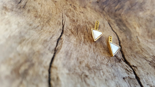 Mother of pearl triangle earring jackets in 14kt yellow gold.