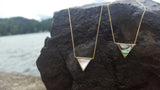 triangle shell and gold necklace by Heather j studios a local Seattle based jewelry designer and artist.