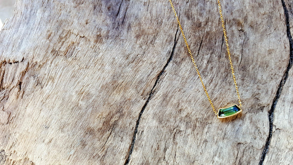 Delicate tourmaline and yellow gold necklace by jewelry designer Heather Johnson.