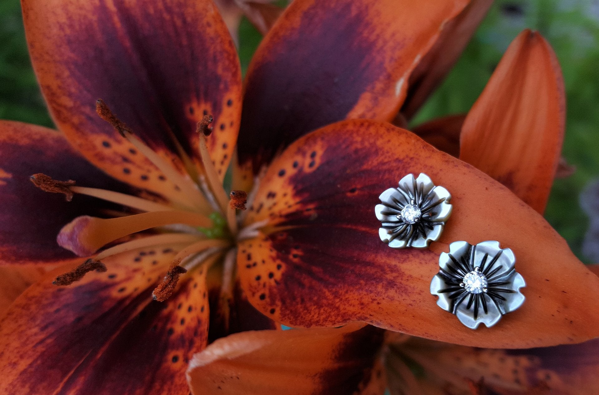 black mother of pearl flower studs with diamonds